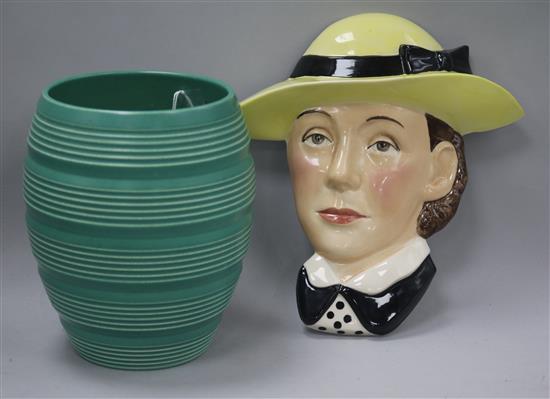 A Keith Murray for Wedgwood ribbed green vase and a Kevin Francis modelled by Douglas Tootle Susie Cooper wall mask.